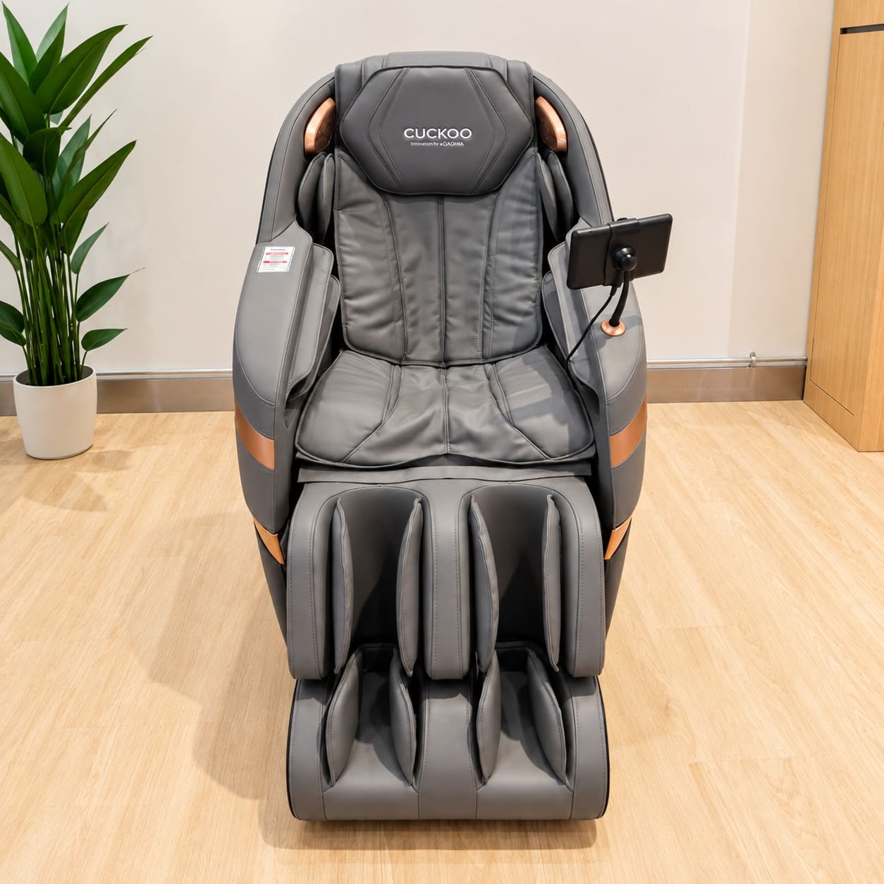 Dark CUCKOO massage chair with a tablet control at the Sunway Putra Mall brandstore